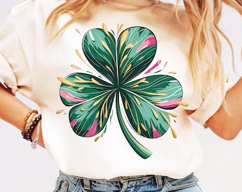 May include: A white t-shirt with a green, pink, and gold four-leaf clover graphic.