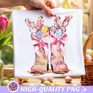 May include: White t-shirt featuring a whimsical Easter design. Two pink cowboy boots are adorned with bunny ears and bows, holding colorful Easter eggs. The text "HIGH-QUALITY PNG" is displayed at the bottom.