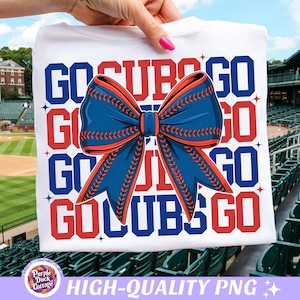 May include: White t-shirt featuring the text "GO CUBS GO" in red and blue. A large blue bow with red stitching is the central design element. The background shows a baseball stadium.