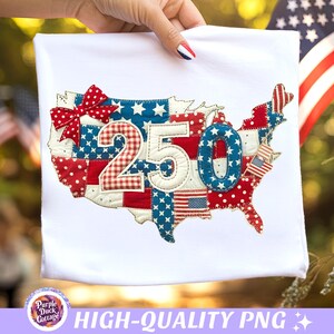 May include: White fabric with a patriotic design featuring the number "250" in the centre, overlaid on a map of the United States. The map is composed of red, white, and blue patchwork with stars and stripes. A red bow is at the top left.