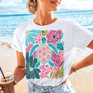 Boho floral sea turtle PNG with pink, blue, turquoise, and green colors for summer sublimation designs, beach shirts, and DTF prints.