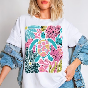 Boho floral sea turtle PNG with pink, blue, turquoise, and green colors for summer sublimation designs, beach shirts, and DTF prints.
