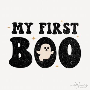 May include: A graphic design featuring the black distressed text MY FIRST BOO with a small cream-colored ghost illustration inside the letter O. The design includes four small gold four-pointed stars and the text wildflower popshop in the corner.