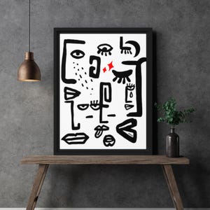 May include: Black and white abstract art print with red accents. The print features various shapes and lines that resemble eyes, lips, and other facial features.