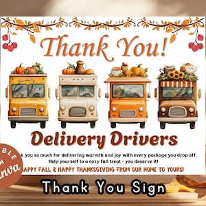 May include: A seasonal sign featuring the text "Thank You!" and "Delivery Drivers." The image shows four delivery vans decorated with pumpkins and autumn elements. The sign also includes the message "Happy Fall & Happy Thanksgiving From Our Home To Yours!"