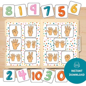 Puede incluir: Imprimible educativo con tarjetas de números e ilustraciones de conteo de dedos. Las tarjetas muestran los números del 0 al 10 en varios colores, con gestos de manos correspondientes. La carpeta tiene un patrón de lunares de colores y las palabras "Descarga instantánea".