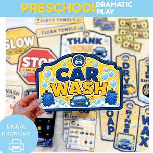 May include: A collection of colorful car wash-themed play set pieces. Includes signs with text like "CAR WASH", "SLOW", and "THANK YOU!", along with car illustrations and bubble graphics. The words "PRESCHOOL DRAMATIC PLAY" are at the top.