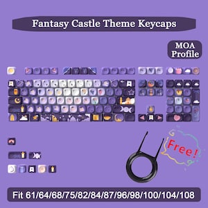 May include: A keyboard with fantasy castle theme keycaps in purple, white, and gold. The image includes a keycap puller and text that reads "Fantasy Castle Theme Keycaps" and "Fit 61/64/68/75/82/84/87/96/98/100/104/108".