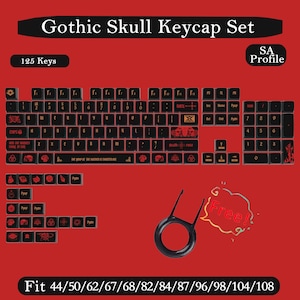 May include: A 125-piece black keycap set with red legends and skull graphics in SA profile. The set includes various keys, a keycap puller, and text reading Gothic Skull Keycap Set, 125 Keys, SA Profile, Free, and Fit 44/50/62/67/68/82/84/87/96/98/104/108.