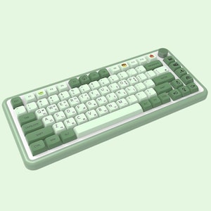 May include: A green and white mechanical keyboard with a variety of keys, including function keys, number keys, and letter keys. The keyboard has a light green case and white keycaps with black lettering.