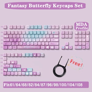 May include: A set of butterfly-themed keycaps in a purple and blue colour scheme. The keycaps are arranged in rows, with the top row labelled "R4" and the bottom row labelled "R1". The keycaps feature a variety of butterfly designs, including butterflies with wings spread, butterflies in flight, and butterflies with their wings closed. The keycaps are also decorated with small stars and other decorative elements. The keycaps are labelled with the letters of the alphabet, numbers, and symbols. The keycaps are designed to fit 61, 64, 68, 82, 84, 87, 96, 98, 100, 104, and 108 key keyboards. The text "MDA Profile" is visible in the upper right corner of the image. The text "Free!" is visible in the lower right corner of the image.