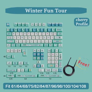 May include: A set of light blue and white keyboard keycaps with a winter theme, featuring illustrations and text. The set includes a keycap puller and is compatible with various keyboard sizes. The text "Winter Fun Tour" and "cherry Profile" are visible.