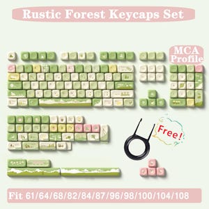 May include: Rustic Forest Keycaps Set in a light green, brown, and pink colour scheme. The keycaps feature a variety of nature-inspired designs, including trees, leaves, and flowers. The set includes a full keyboard layout, as well as a few extra keycaps. The keycaps are compatible with 61, 64, 68, 82, 84, 87, 96, 98, 100, 104, and 108 key keyboards. The set also includes a keycap puller and a free keycap.