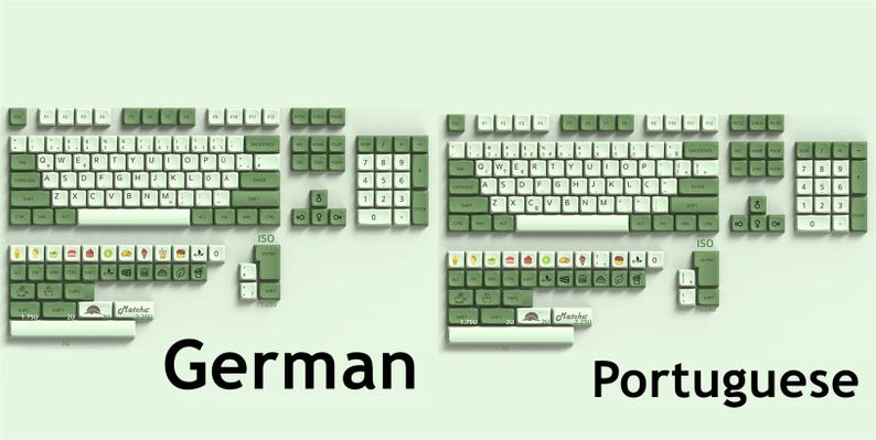 May include: A set of green and white keyboard keycaps with the words "German" and "Portuguese" printed below. The keycaps are arranged in two rows, with the German keycaps on the left and the Portuguese keycaps on the right.