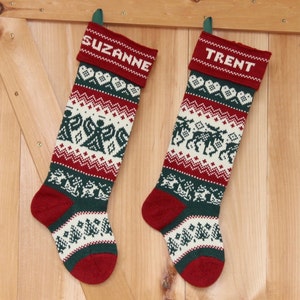 May include: Two red and green Christmas stockings with white knit designs. The stockings are personalized with the names "Suzanne" and "Trent".