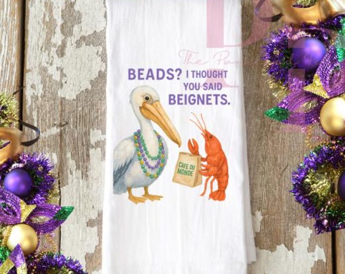 Mardi gras beads and beignets decorative tea towel
