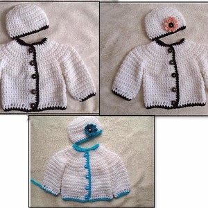 May include: Three crocheted baby cardigans with matching hats. The cardigans are white with black, white, or blue trim. The hats have a flower embellishment.