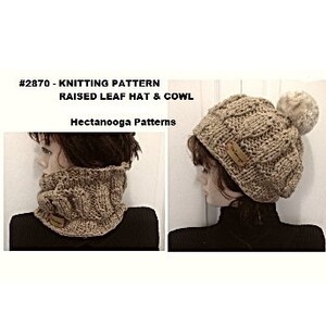 May include: Knitting pattern for a raised leaf hat and cowl. The pattern is shown in a beige color. The hat has a pompom on top. The cowl is a neck warmer.