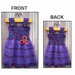 May include: A purple and blue crocheted dress with pink flower embellishments. The dress has a fitted bodice and a full skirt. The dress is displayed on a hanger with the words "FRONT" and "BACK" above it.