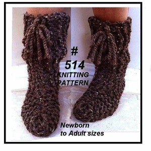 May include: A pair of knitted brown and white speckled boot-style slippers. The slippers have a folded-over cuff with a tassel tie. The text in the image reads "#514 KNITTING PATTERN Newborn to Adult sizes."