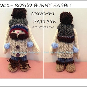 May include: A crocheted bunny rabbit doll, 24 cm tall, with a brown mustache, hat, and boots. The doll wears a beige sweater, blue shorts, and blue mittens. The text "3001- ROSCO BUNNY RABBIT CROCHET PATTERN" is at the top.