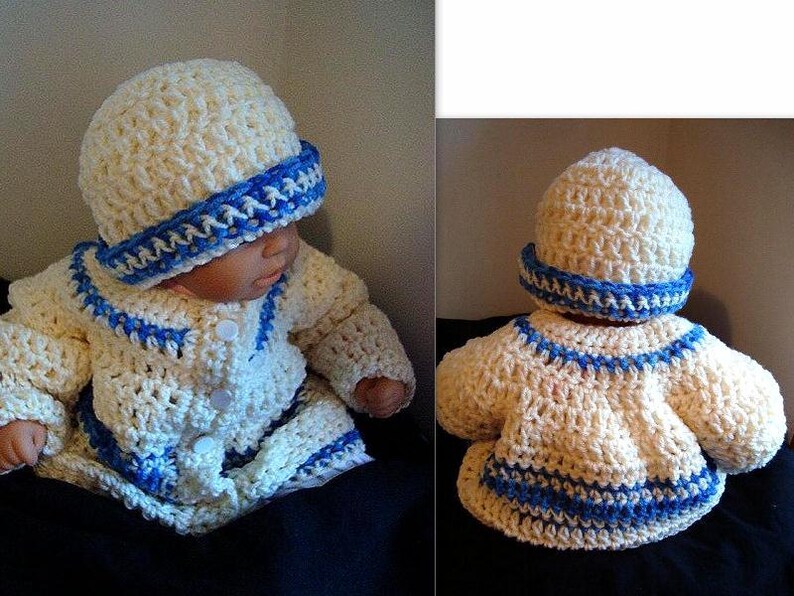 May include: A cream-colored, crocheted baby outfit, including a hat and jacket, trimmed with blue yarn. The jacket has a button closure. The hat has a blue band. The outfit is designed for a baby.