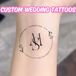Peut inclure: Un tatouage temporaire avec un motif circulaire comprenant les noms "Mariana + Sebastian", les initiales "MS" et la date "02.02.2030".