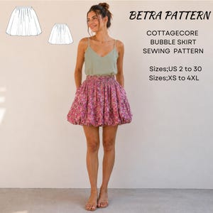 Könnte beinhalten: Ein Betra Pattern Cottagecore-Bubblerock-Schnittmuster für die Größen US 2 bis 30 und XS bis 4XL. Der Rock ist rosa mit Blumenmuster, hat einen gerafften Gummibund und eine voluminöse Silhouette mit abgerundetem Saum.