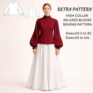 May include: A woman wearing a burgundy high-collar blouse with long, voluminous sleeves and a white skirt. The image includes a sewing pattern illustration and text that reads "BETRA PATTERN HIGH COLLAR RELAXED BLOUSE SEWING PATTERN" and size information.
