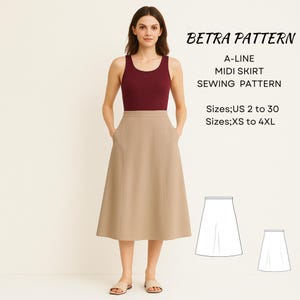 Può includere: Una donna indossa un top bordeaux e una gonna midi beige a trapezio con tasche. La gonna arriva a metà polpaccio. L'immagine include il testo "BETRA PATTERN A-LINE MIDI SKIRT SEWING PATTERN" e informazioni sulle taglie.