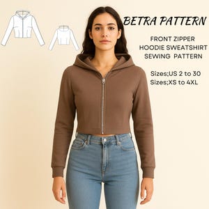 May include: A brown, cropped hoodie with a front zip, worn with blue jeans. The image includes a sewing pattern with the text "BETRA PATTERN" and "FRONT ZIPPER HOODIE SWEATSHIRT SEWING PATTERN". Sizes US 2 to 30 and XS to 4XL are listed.
