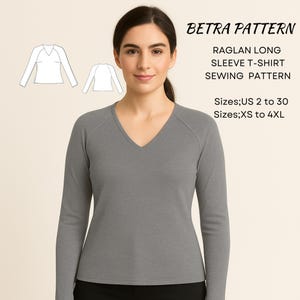 May include: A woman wearing a gray raglan long sleeve t-shirt with a V-neck. The image includes a sewing pattern with the text "BETRA PATTERN" and "RAGLAN LONG SLEEVE T-SHIRT SEWING PATTERN". Sizes available are US 2 to 30 and XS to 4XL.