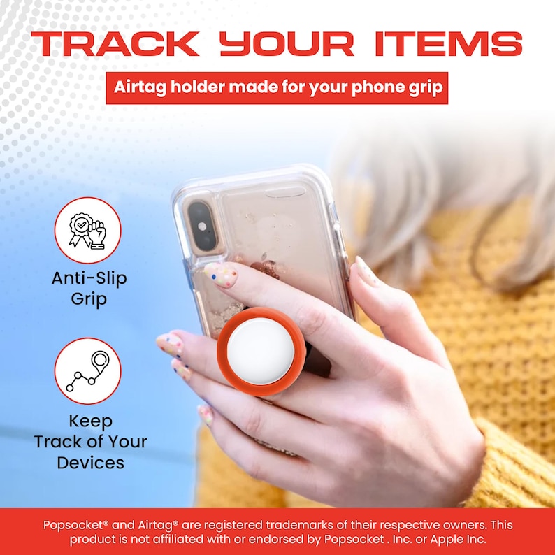Może przedstawiać: Pomarańczowy i biały uchwyt AirTag przymocowany do przezroczystego etui na telefon. Tekst brzmi "Track Your Items" i "Anti-Slip Grip". Uchwyt jest przeznaczony do użytku z uchwytem do telefonu.