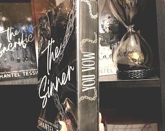 The sinner by Shantel tessier with custom hand painted edges