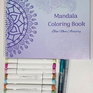 May include: A spiral-bound mandala coloring book with a purple and blue gradient cover, featuring intricate floral designs. The book is paired with a set of colorful Ohuhu markers and other art pens, perfect for creative projects.