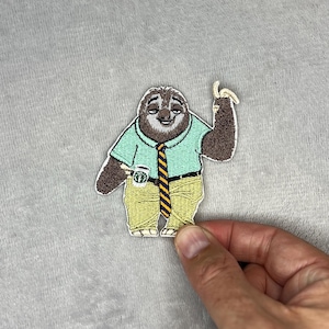 Broderad stryklapp med Flash the Sloth
