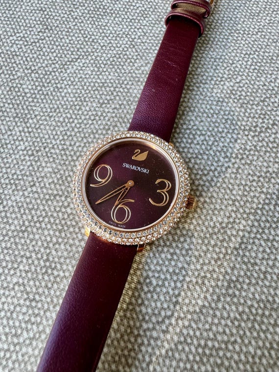 Swarovski Crystal Maroon Ladies Watch: Diamond Bezel, Leather Strap
