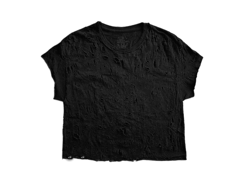 May include: Black short-sleeved t-shirt with a distressed, ripped look. The fabric is thin and has a lot of holes throughout.