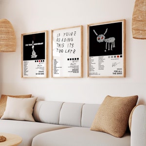 May include: Three framed black and white prints with white text and a black and white illustration of a dog. The text on the prints reads "Five Year Anniversary", "If You're Reading This It's Too Late", and "Drake For All The Dogs".