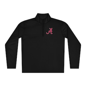 May include: Black long-sleeve pullover with a mock neck and a quarter-zip closure. Features a crimson "A" logo on the left chest. The athletic top is made of a lightweight, breathable material.