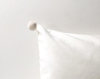 velvet pillow with pom poms- white