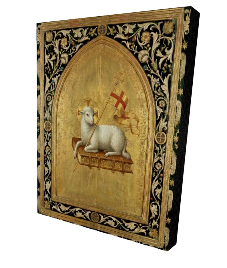 May include: A religious artwork featuring a lamb holding a flag with a cross, set against a gold background. The artwork is framed with ornate black and gold floral designs. The lamb is white, and the flag is red and white.
