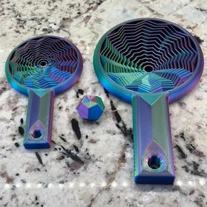 May include: A white ceramic mug with a black handle and the text "But First, Coffee" in a bold, black font. The mug is set against a neutral background, highlighting its simple design.