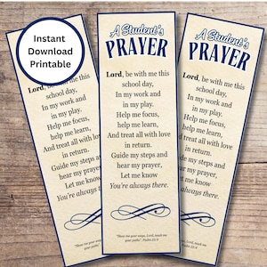 May include: Three rectangular bookmarks with a cream background and navy blue text. The text reads "A Student's Prayer" at the top, with a prayer below. One bookmark has a circular "Instant Download Printable" graphic.