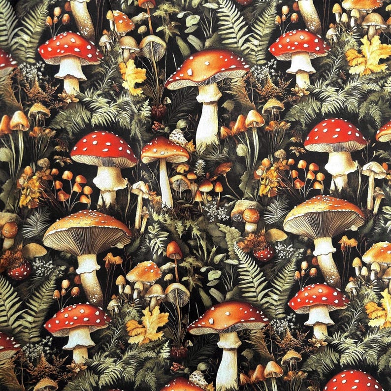 Flat view of a fabric design filled with detailed illustrations of red and brown mushrooms surrounded by green fern fronds and foliage.