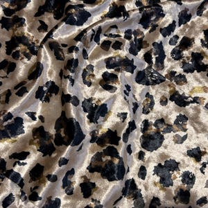 leopard Velvet fabric. Luxury shiny fabric. Pattern Printed on velvet.