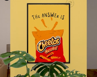 May include: A digital illustration of a bag of Cheetos Crunchy cheese puffs with the text "The answer is" above the bag. The bag is orange and red with the Cheetos logo in white. The background is yellow.