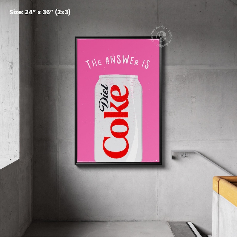 May include: A pink poster with black framing featuring a can of Diet Coke with the text "THE ANSWER IS" above it. The poster measures 24 inches by 36 inches.