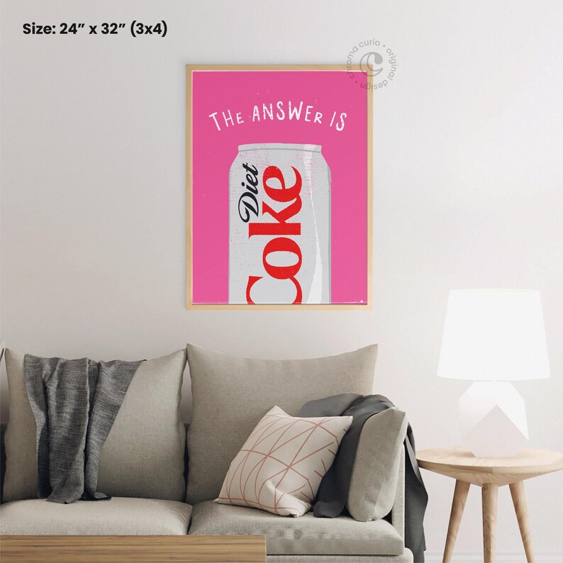 May include: A pink framed print with the text "THE ANSWER IS" and a can of Diet Coke. The can is silver with red lettering. The print measures 24 inches by 32 inches.