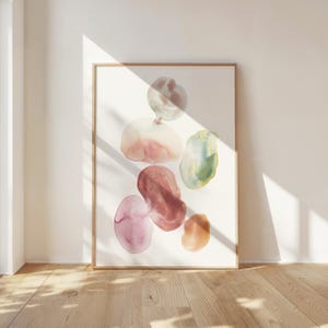 Pode incluir: Impress&atilde;o de arte abstrata com um grupo de formas org&acirc;nicas coloridas em tons de rosa, vermelho, verde e marrom. As formas lembram gotas de &aacute;gua ou seixos, criando uma est&eacute;tica visualmente atraente e moderna.
